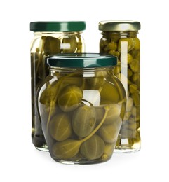 Capers in glass jars isolated on white