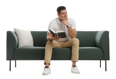 Photo of Man with book on comfortable green sofa against white background