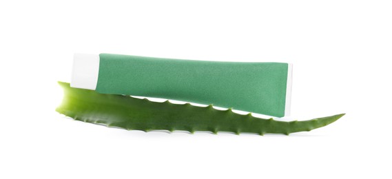 Tube of toothpaste with aloe vera leaf on white background