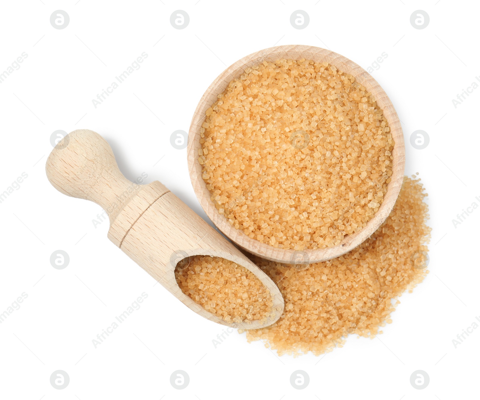 Photo of Brown sugar in bowl and scoop isolated on white, top view