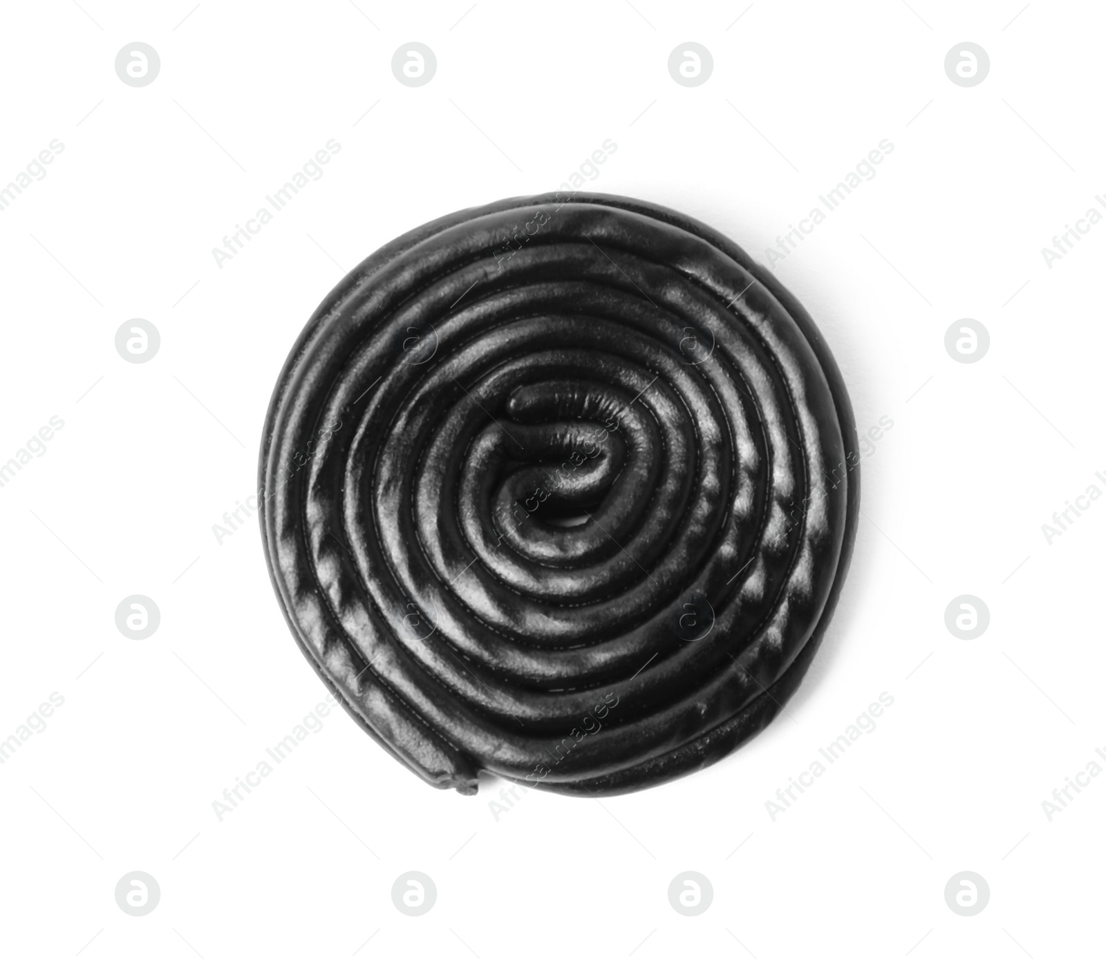 Photo of Tasty black liquorice candy isolated on white, top view