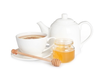 Photo of Cup of tea with lemon, honey and teapot on white background