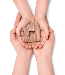 Photo of Home security concept. Woman with her little child holding house model on white background, top view