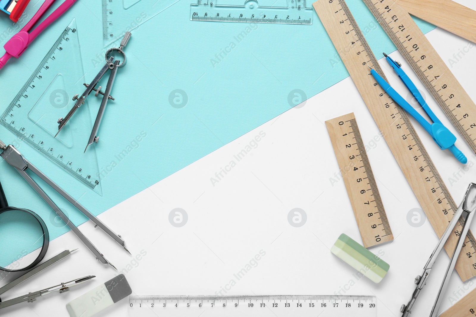 Photo of Flat lay composition with different rulers and compasses on color background. Space for text