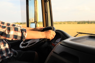 Photo of Man driving modern truck on sunny day, closeup