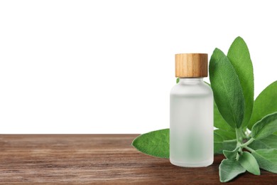 Photo of Bottle of essential oil and sage on wooden table against white background