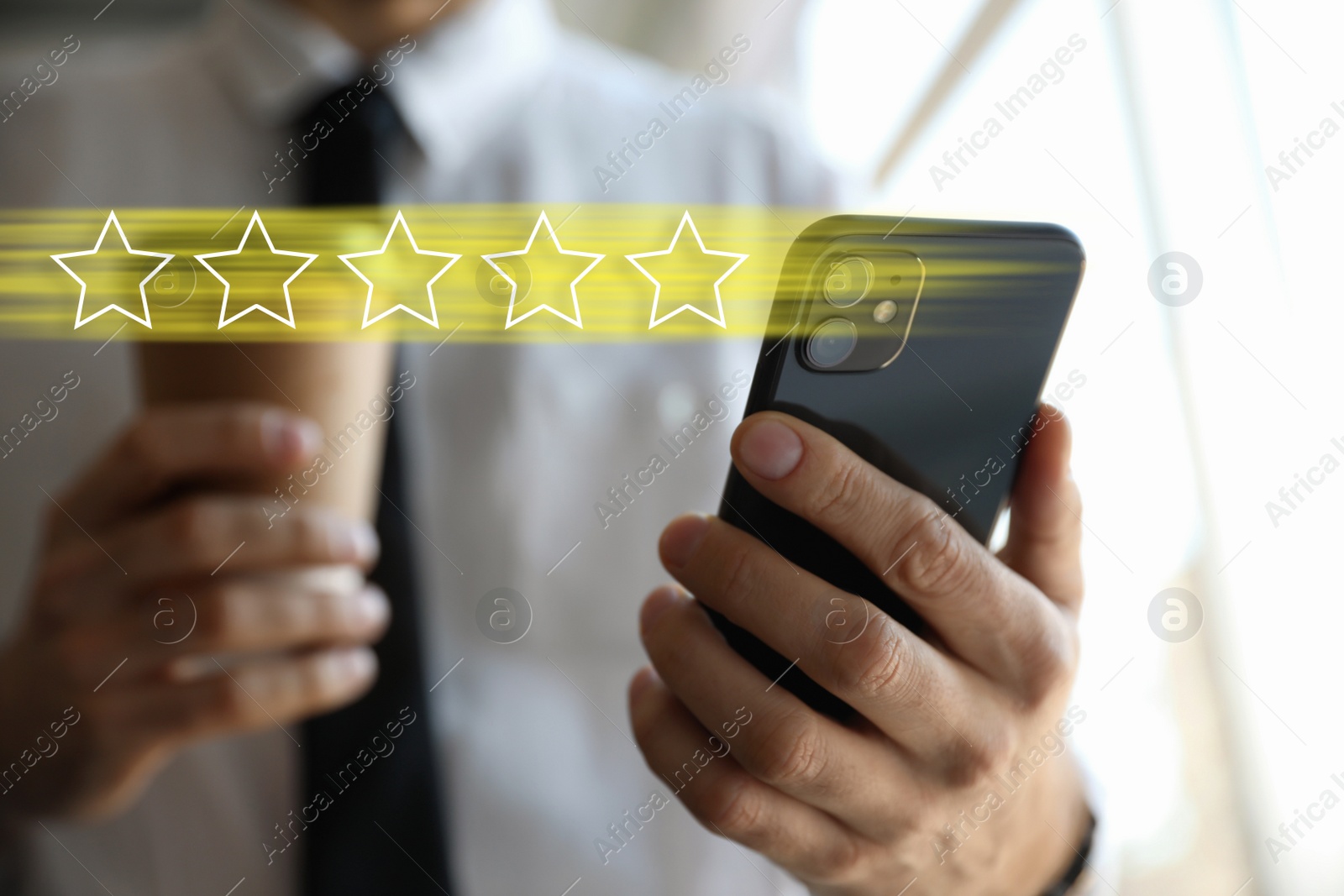 Image of Man with smartphone giving feedback indoors, closeup. Customer review