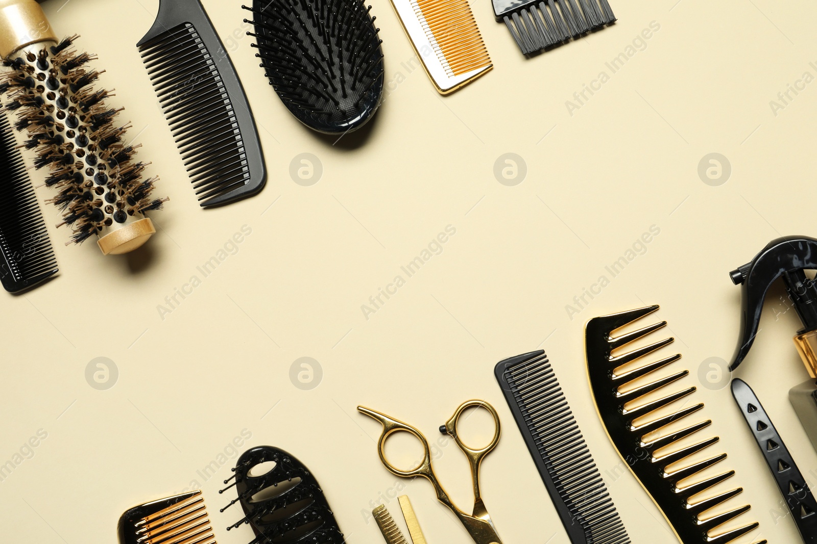 Photo of Hairdressing tools on beige background, flat lay. Space for text