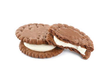 Photo of Tasty chocolate sandwich cookies with cream on white background