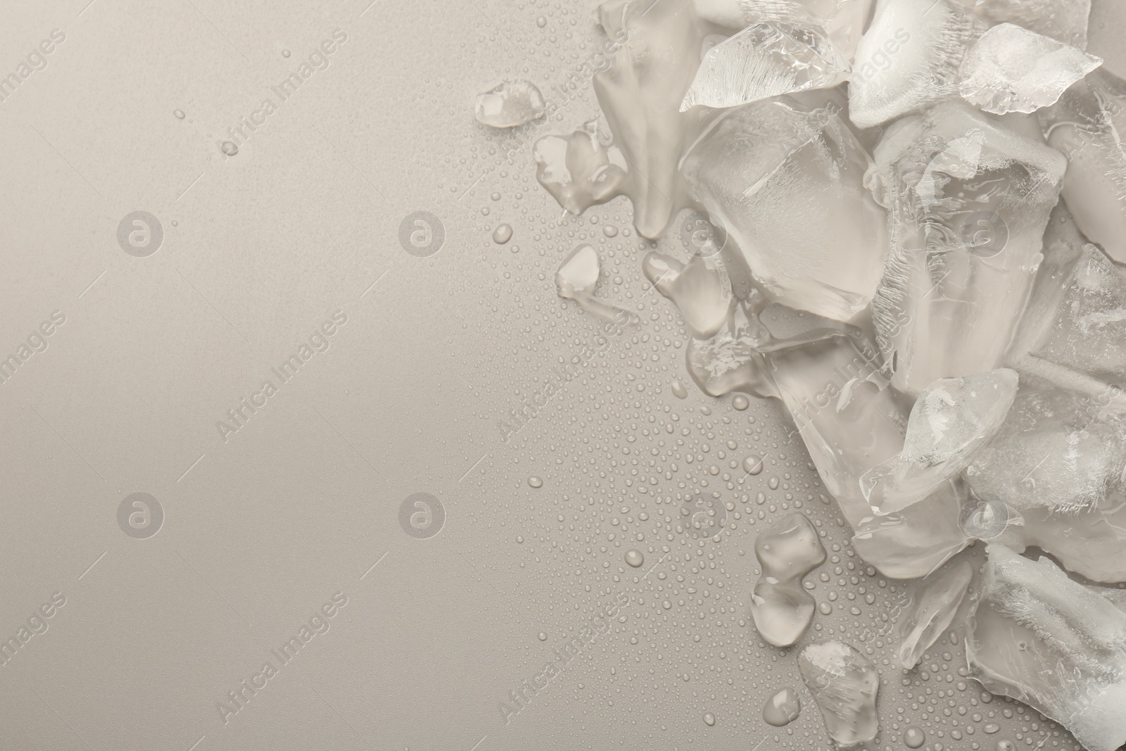 Photo of Pieces of crushed ice on grey background