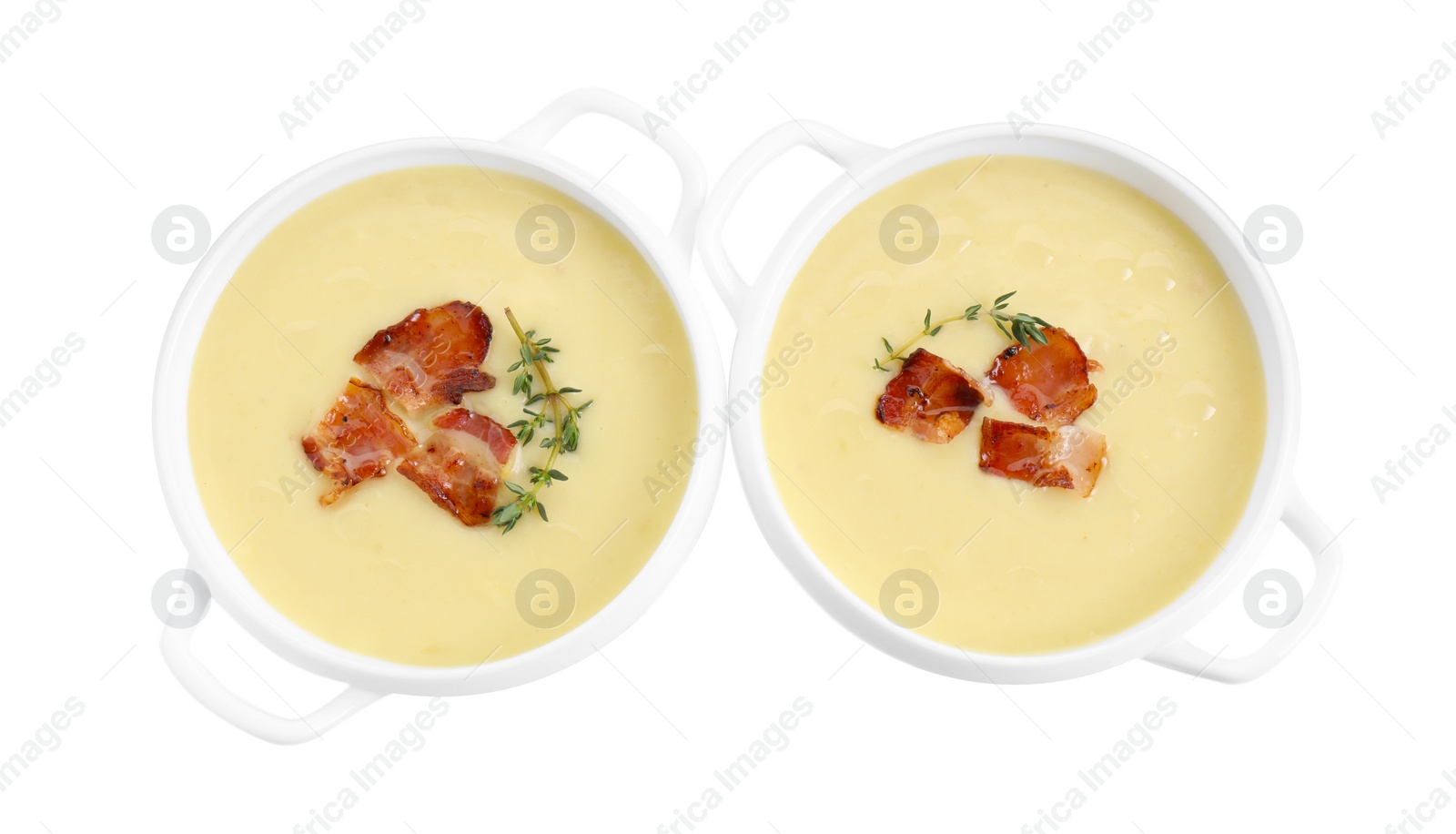 Photo of Tasty potato soup with bacon and rosemary in bowls isolated on white, top view