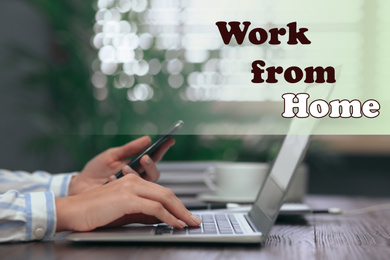 Woman with mobile phone and modern laptop at table, closeup. Work from home