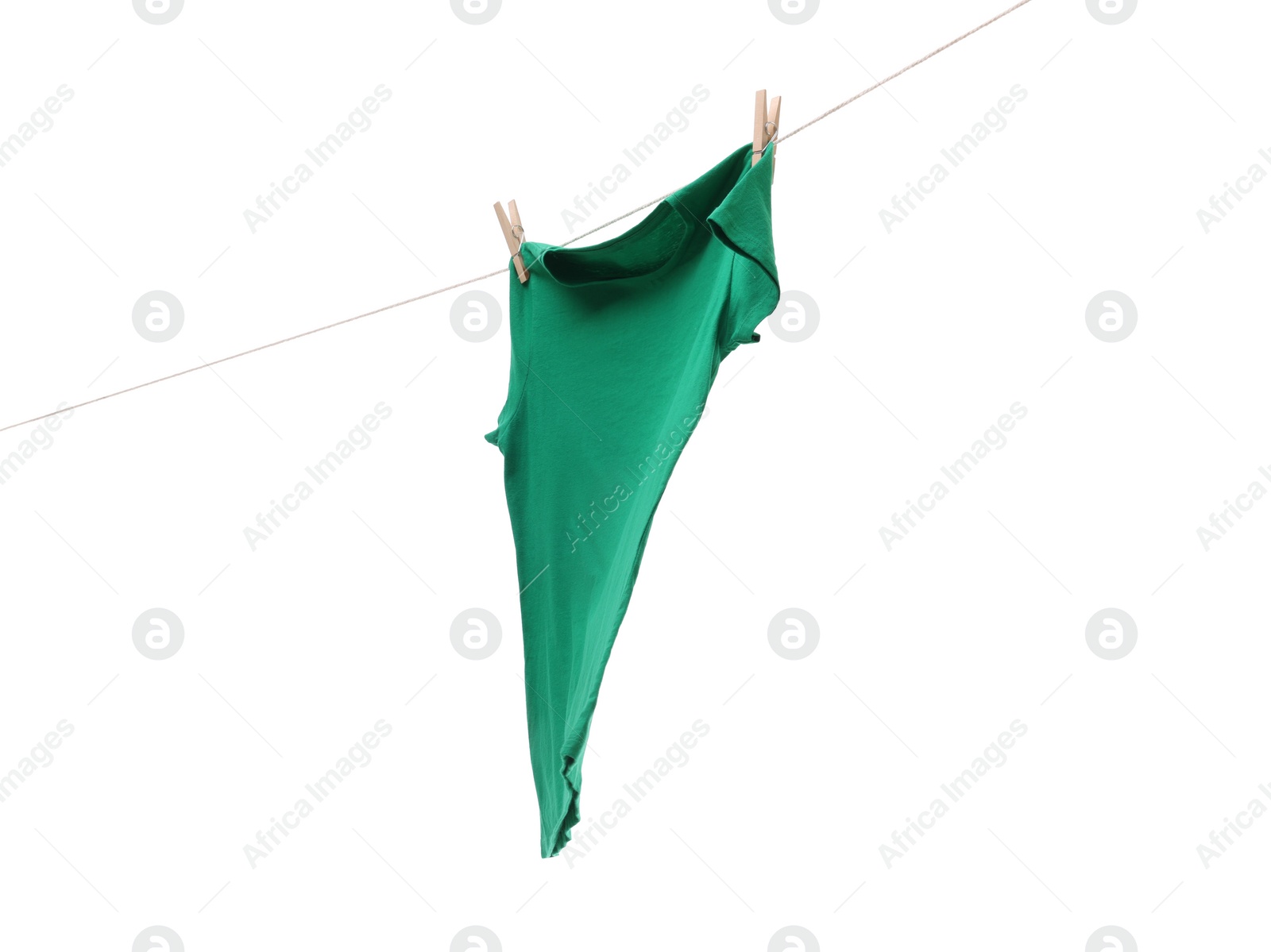 Photo of One green t-shirt drying on washing line isolated on white