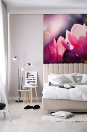 Image of Stylish bedroom interior with furniture and beautiful floral wallpapers