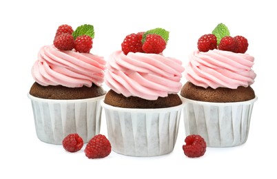 Photo of Sweet cupcakes with fresh raspberries on white background