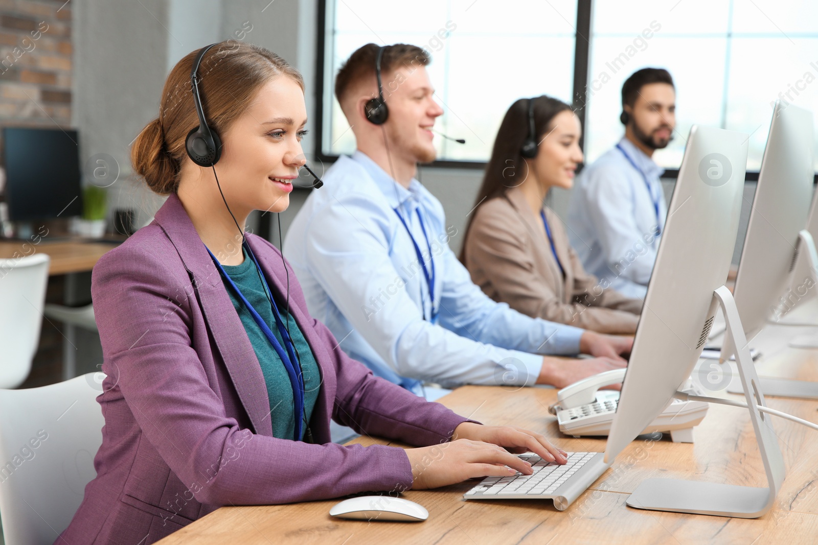 Photo of Technical support operators working in modern office