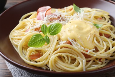 Photo of Delicious spaghetti with cheese sauce and meat on table, closeup