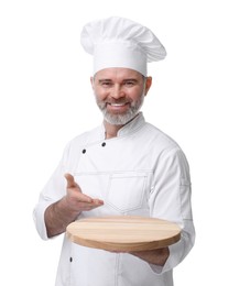 Photo of Happy chef in uniform holding wooden board on white background