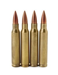 Photo of Many bullets on white background. Military ammunition