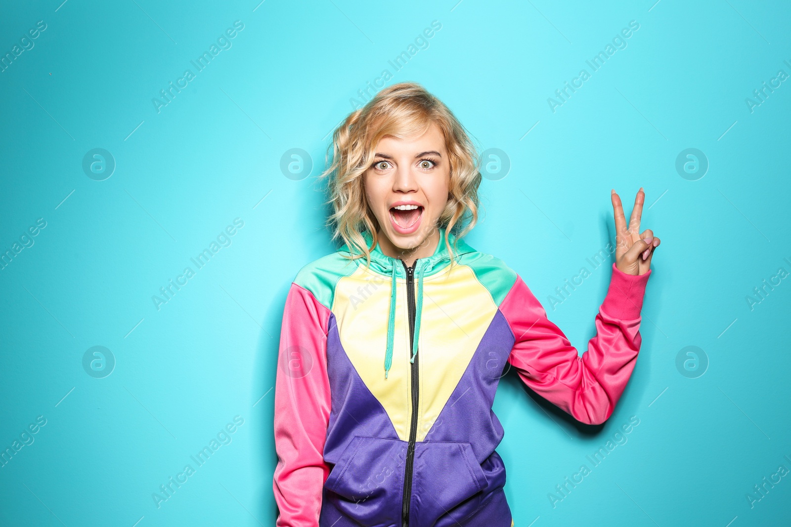 Photo of Emotional stylish young woman on color background