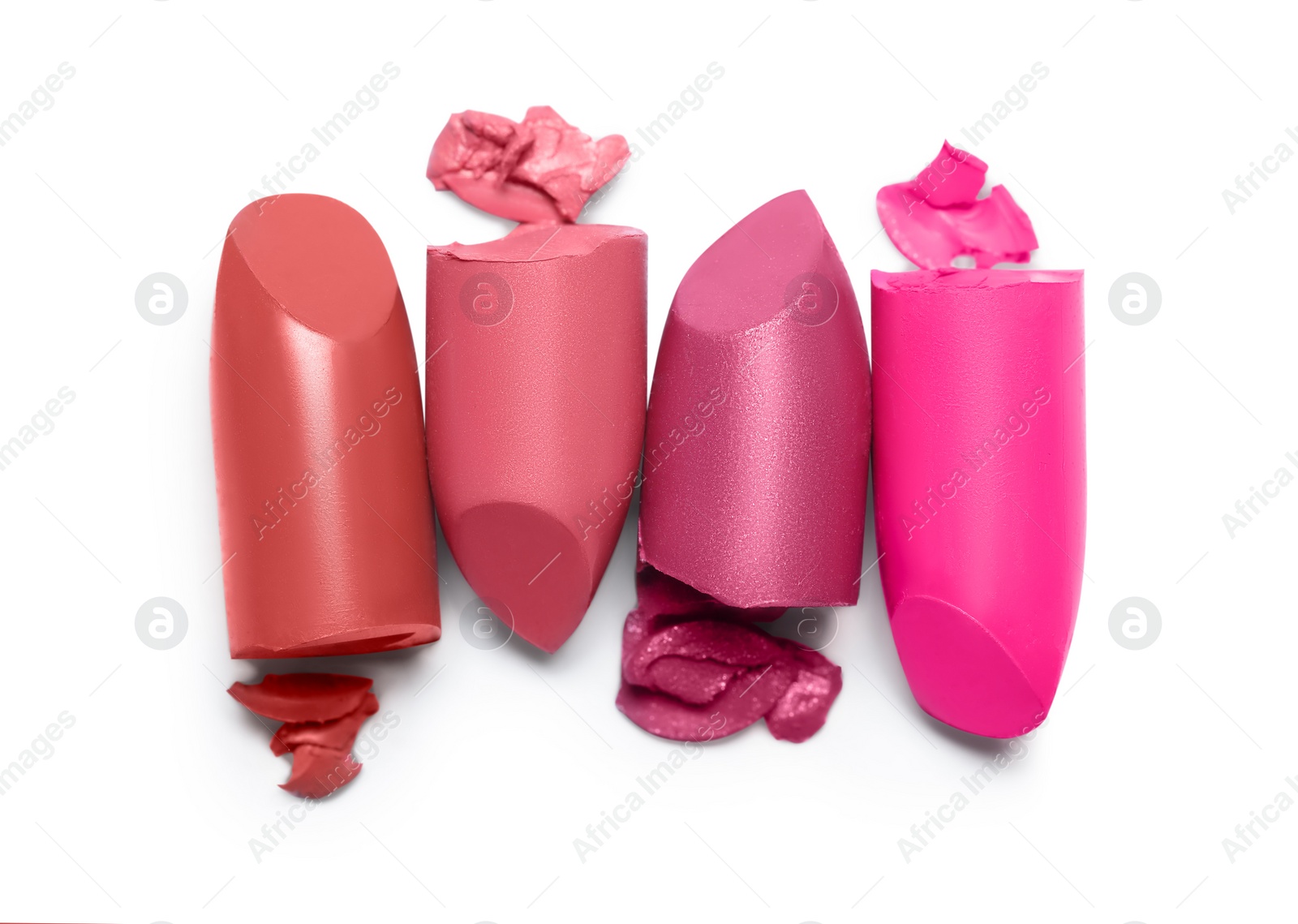 Photo of Many different bright lipsticks on white background, top view