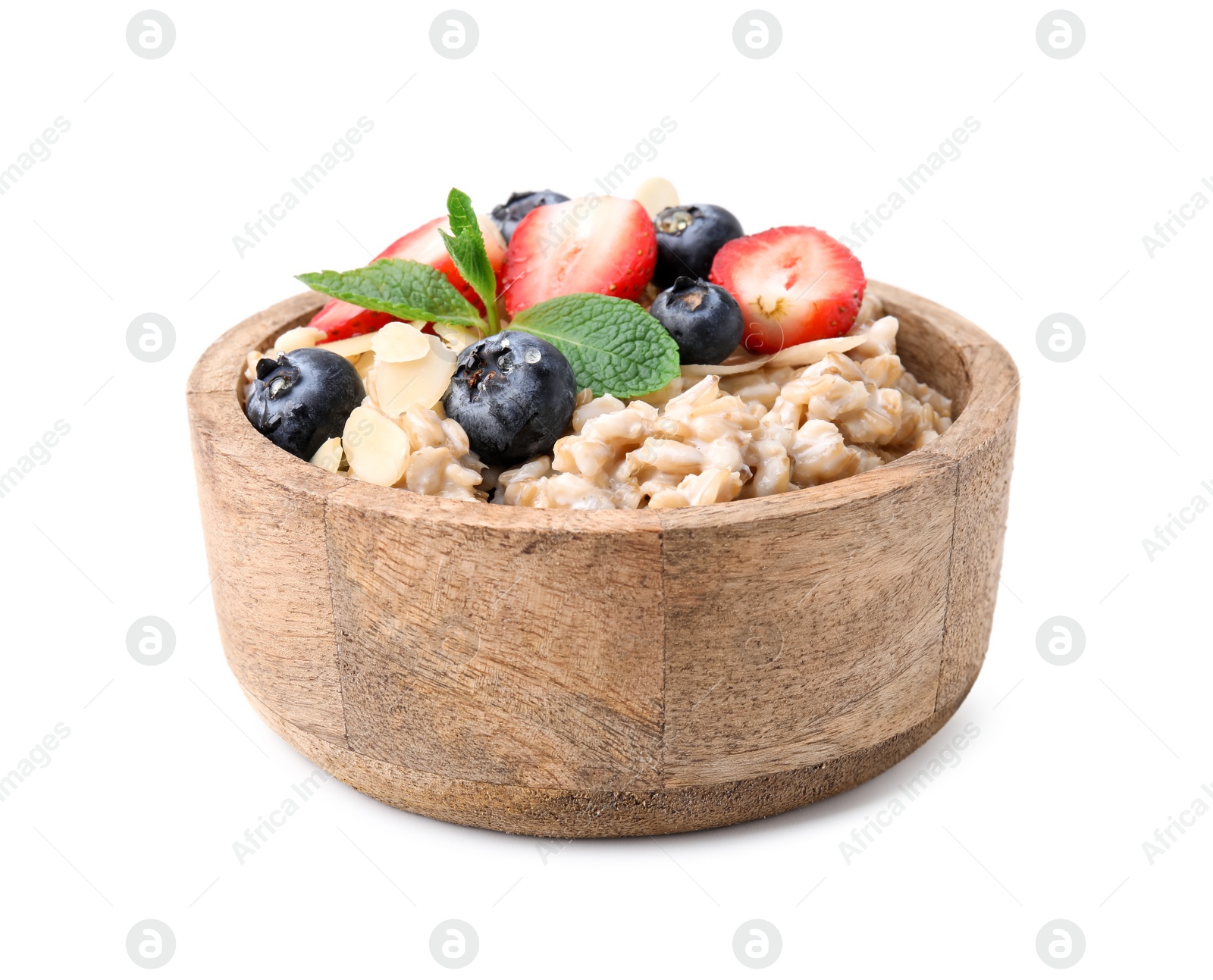 Photo of Tasty oatmeal with strawberries, blueberries and almond flakes in bowl isolated on white