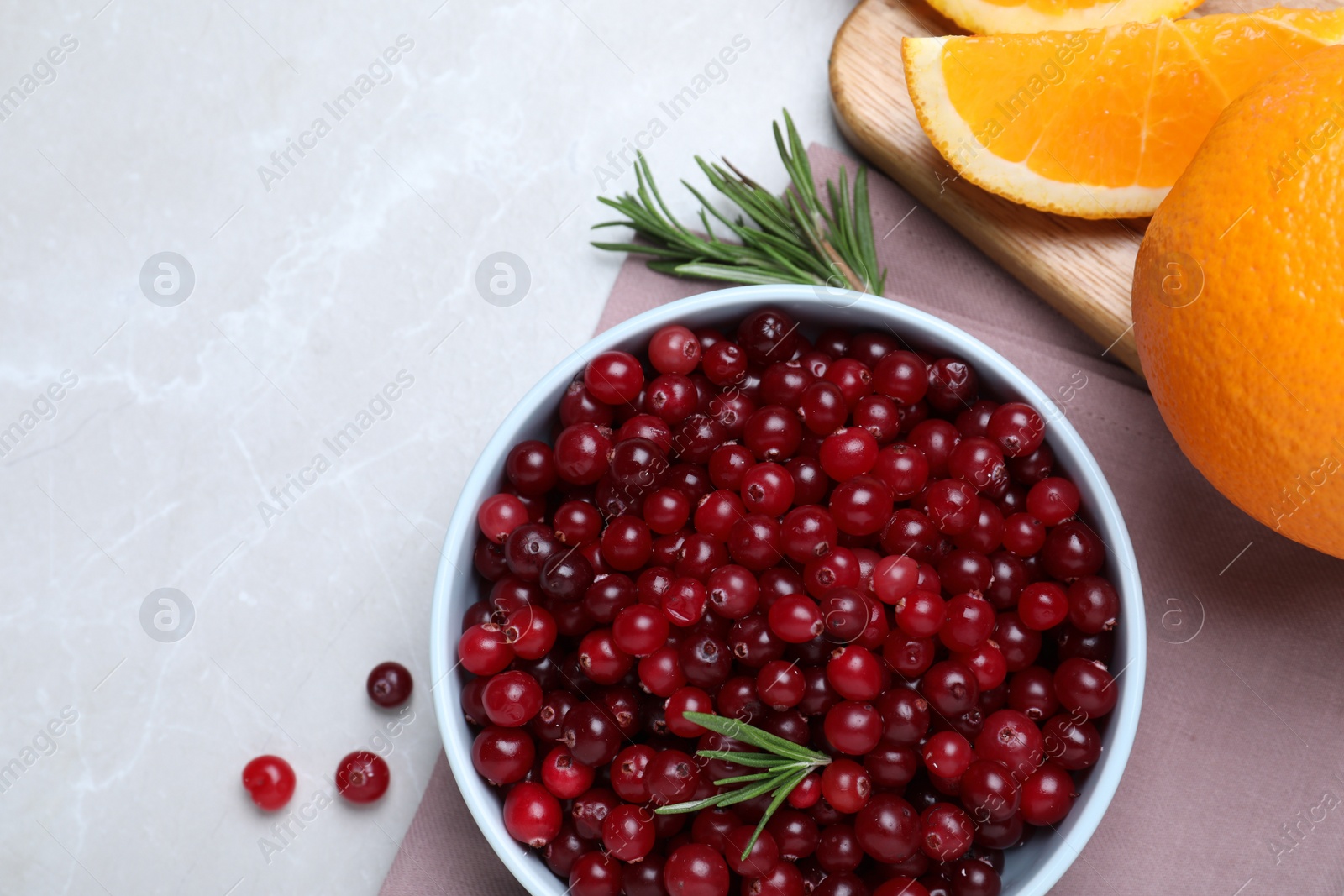 Photo of Flat lay composition with fresh ripe cranberries on light table