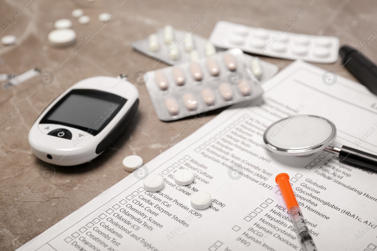 Photo of Composition with form for laboratory test, digital glucometer, medicine and stethoscope on color background. Diabetes concept