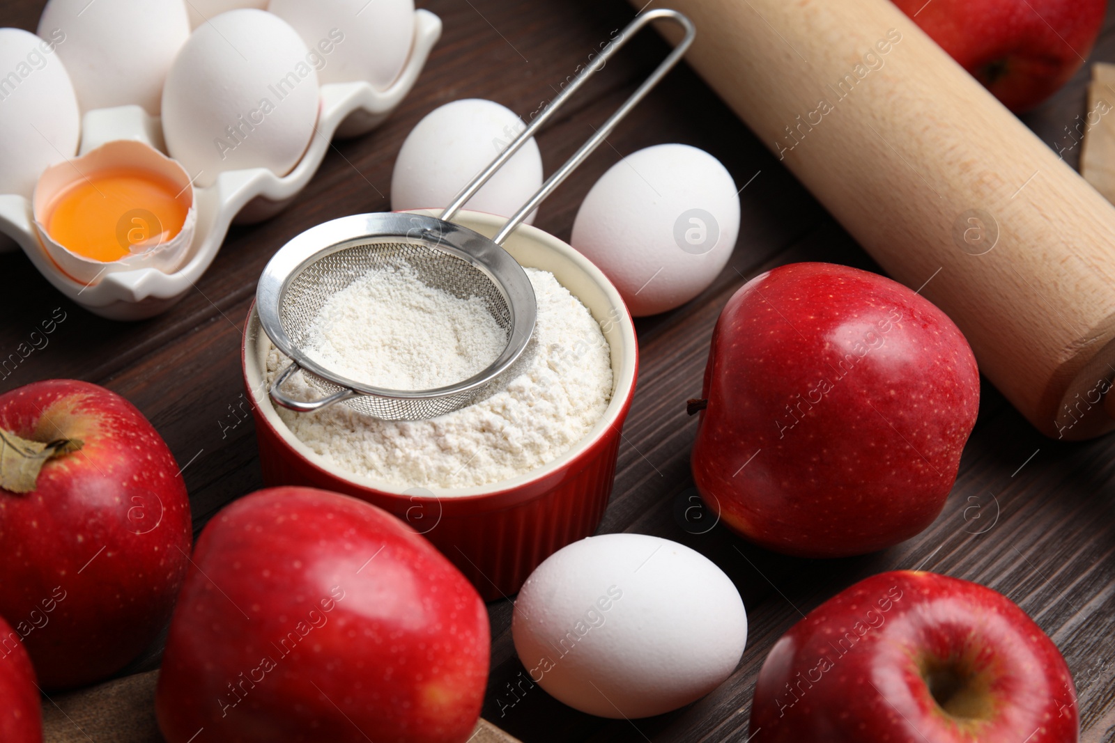 Photo of Traditional English apple pie ingredients on wooden table