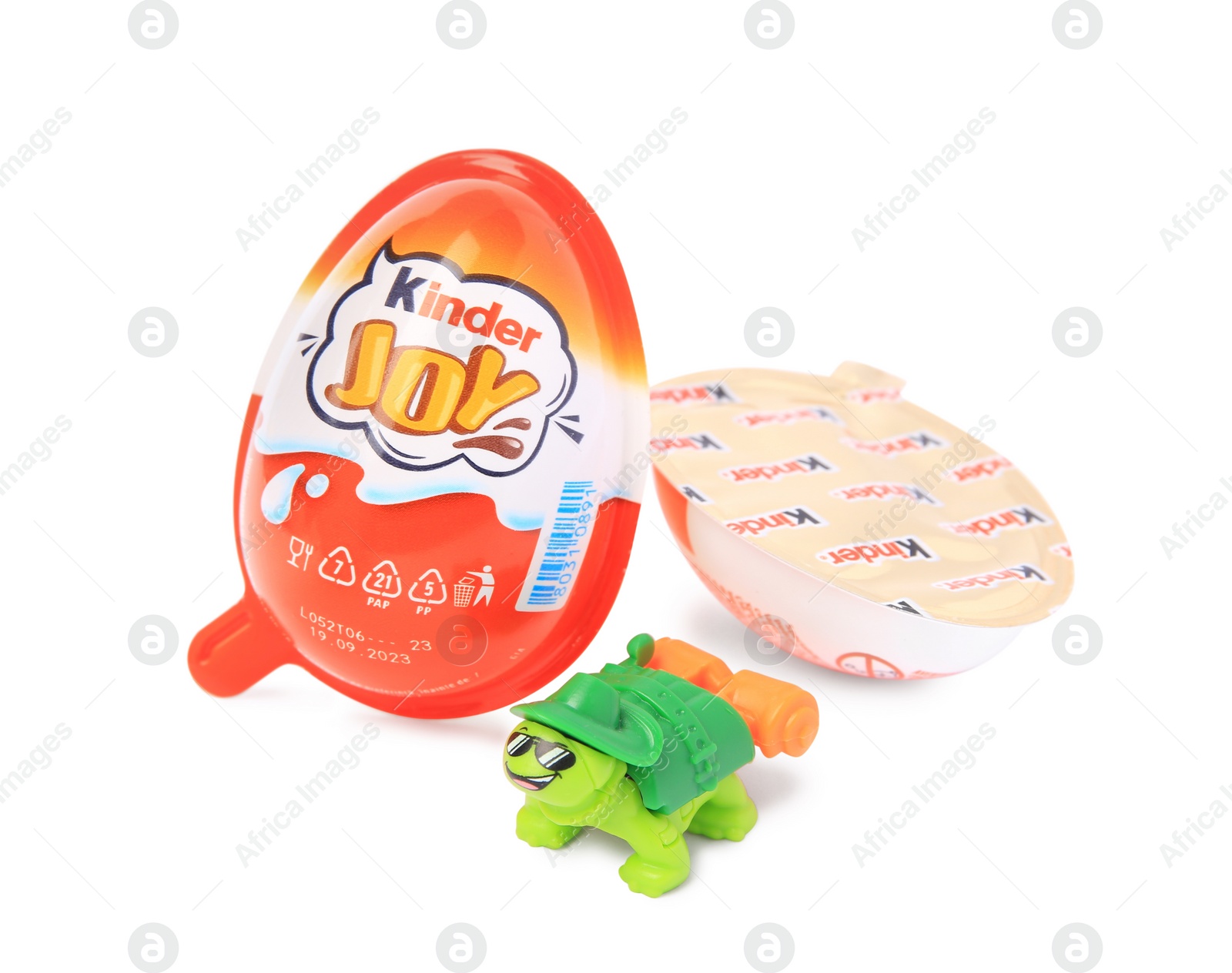 Photo of Slynchev Bryag, Bulgaria - May 24, 2023: Kinder Joy Egg and toy turtle isolated on white