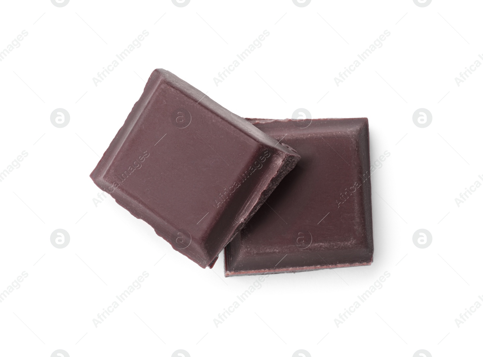 Photo of Pieces of delicious dark chocolate bar on white background, top view