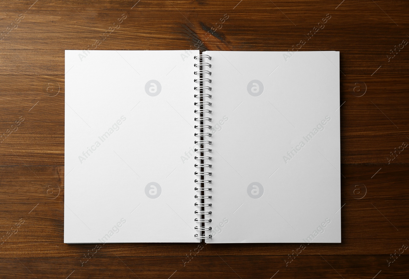 Photo of Blank paper brochure on wooden table, top view. Mockup for design