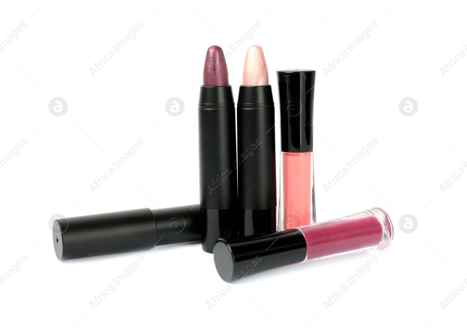 Photo of Set of colorful lipsticks isolated on white