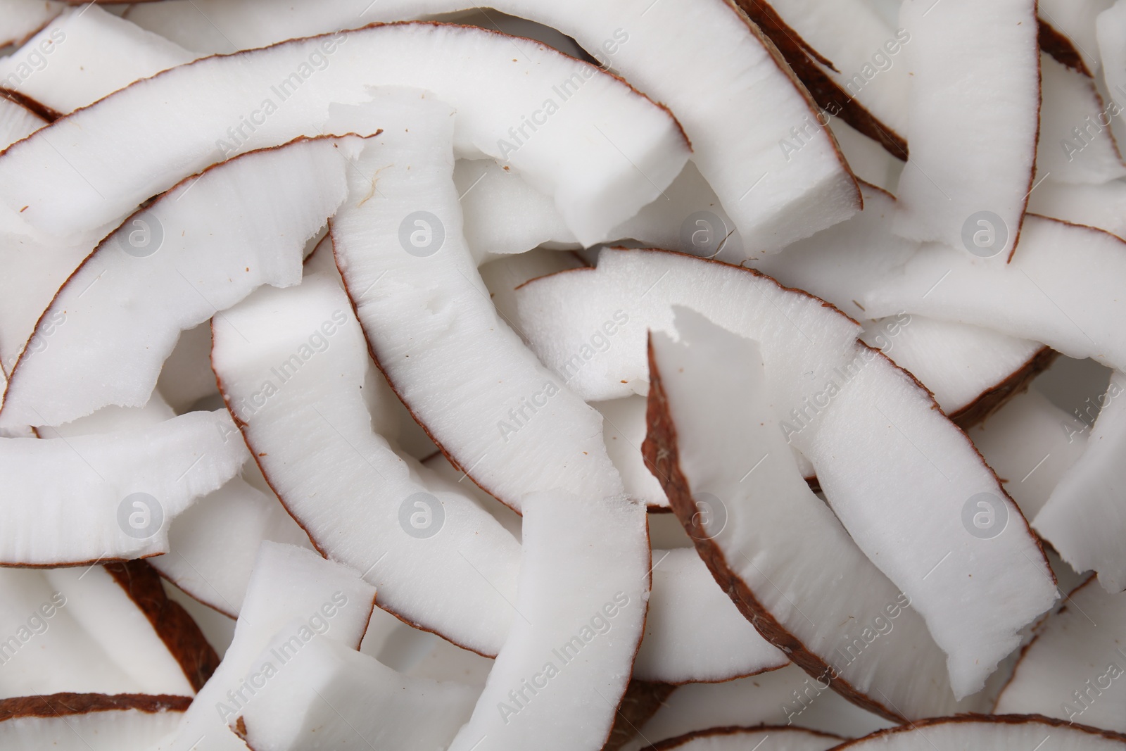 Photo of Fresh coconut pieces as background, closeup view