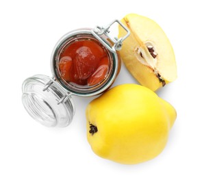 Photo of Tasty homemade quince jam in jar and fruits isolated on white, top view