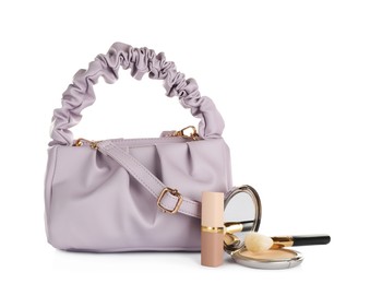 Photo of Purple women's mini bag and cosmetics on white background