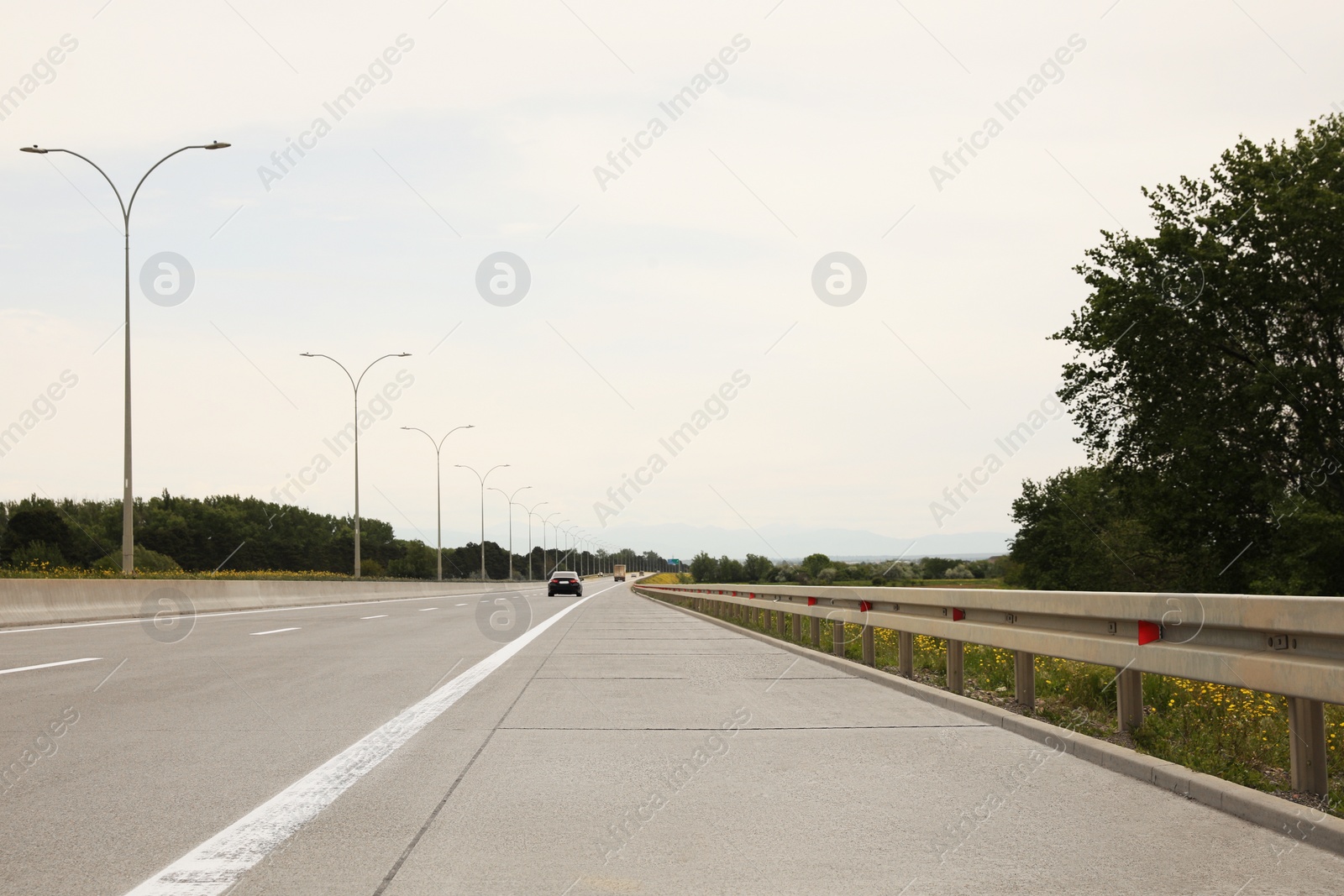 Photo of Picturesque view of asphalt road on cloudy day