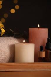 Photo of Beautiful composition with different spa products on table against blurred lights