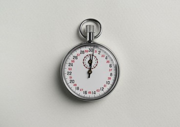 Photo of Vintage timer on light grey background, top view