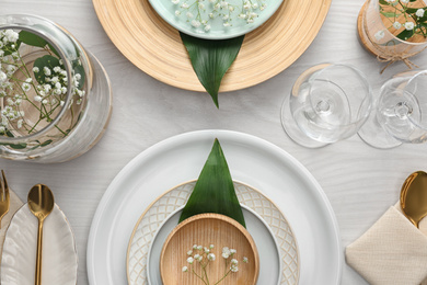 Photo of Elegant festive setting on white wooden table, flat lay