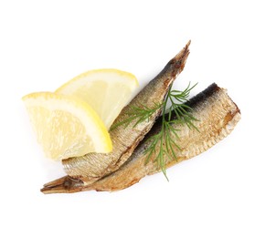 Photo of Tasty canned sprats, lemon and dill isolated on white, top view