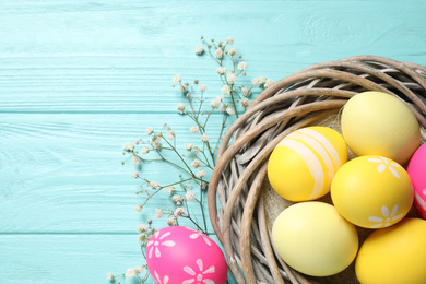 Photo of Flat lay composition with Easter eggs on light blue wooden background