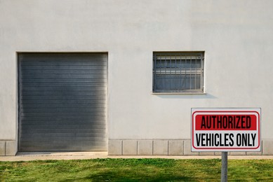 Image of Sign with text Authorized Vehicles Only near building outdoors