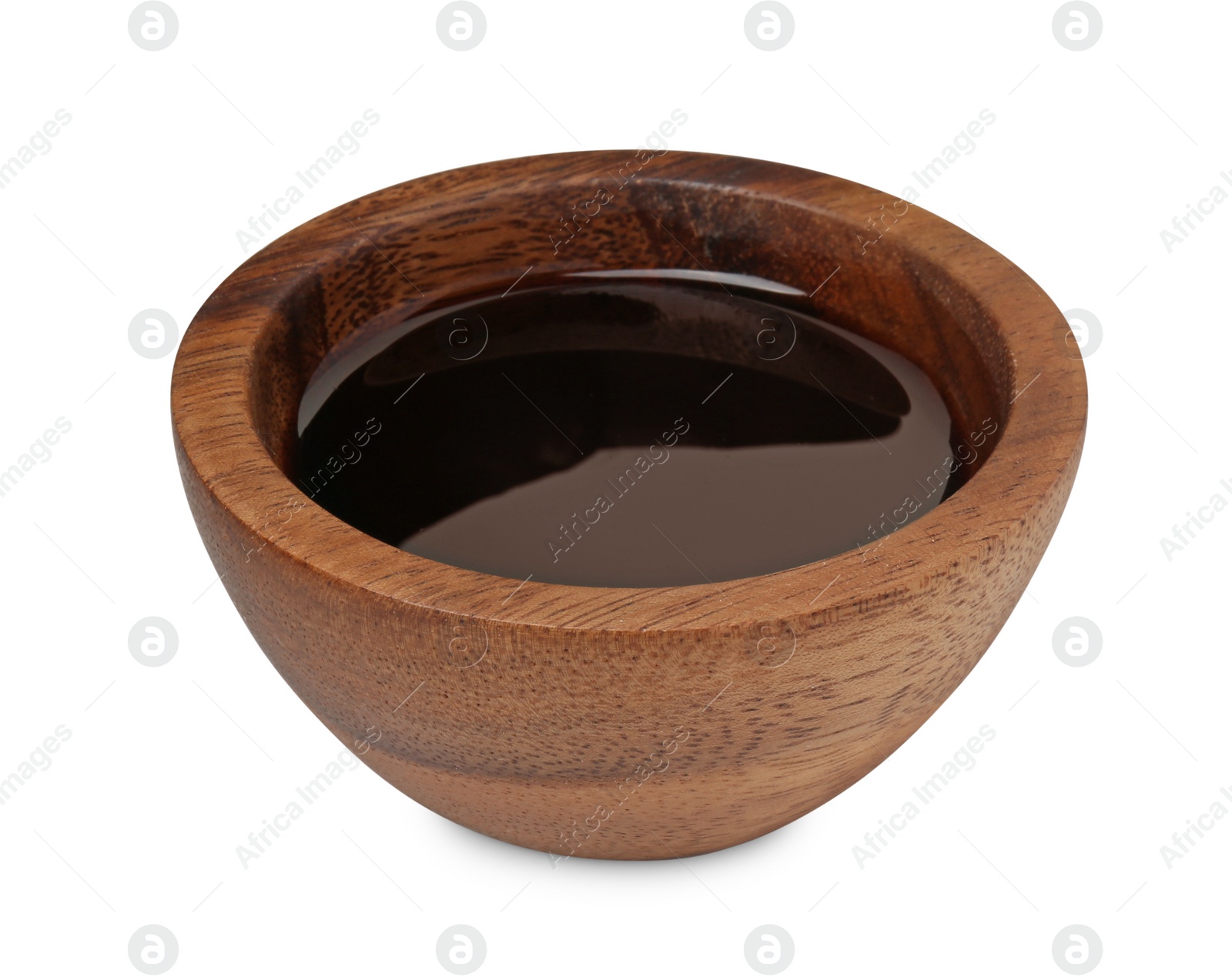 Photo of Tasty soy sauce in wooden bowl isolated on white