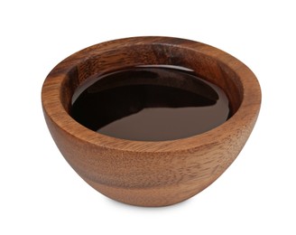 Photo of Tasty soy sauce in wooden bowl isolated on white