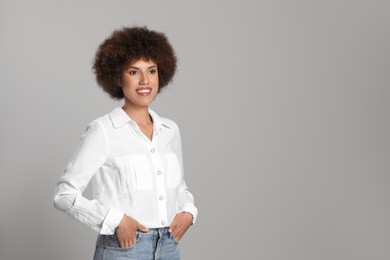 Photo of Portrait of beautiful young woman on grey background. Space for text