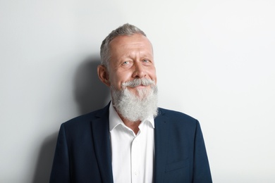 Photo of Portrait of handsome senior man on white background
