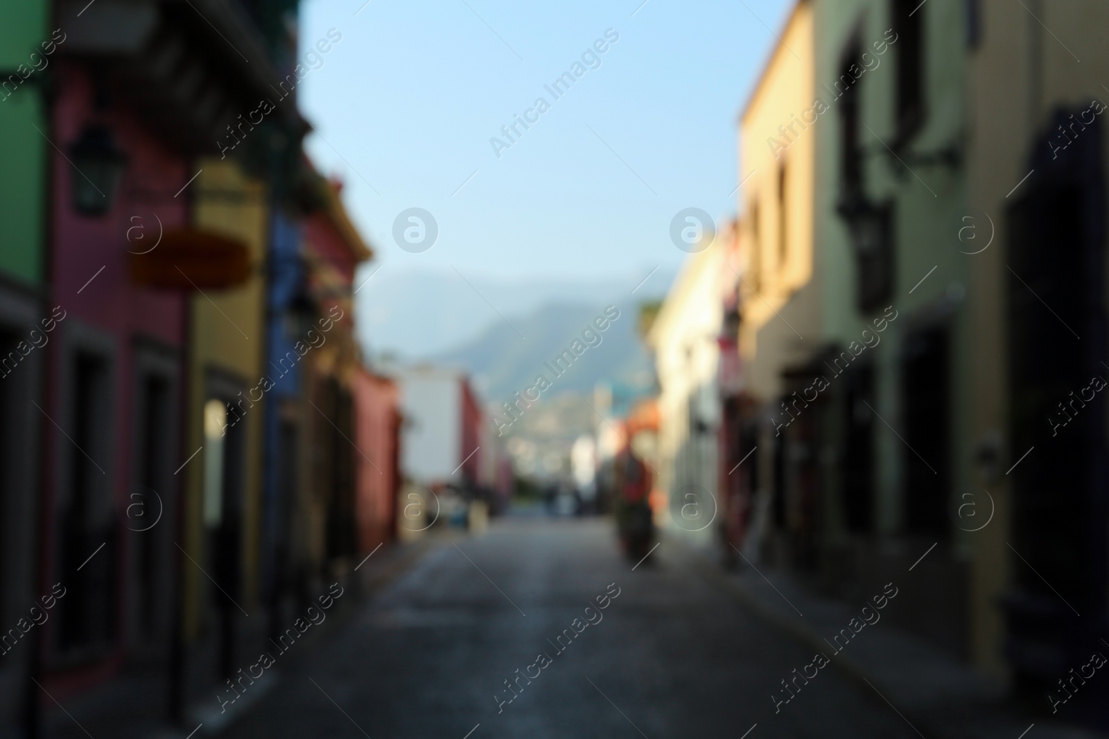 Photo of Blurred view of city street with old buildings