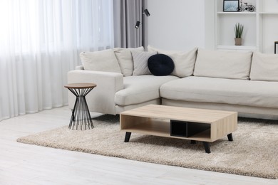 Photo of Beautiful carpet and furniture in living room