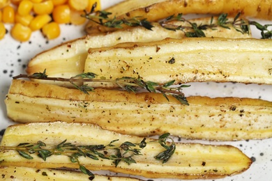 Photo of Baked white carrot with thyme, closeup view